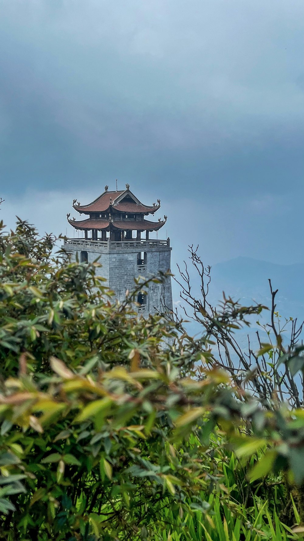 a tall tower with a clock on top of it