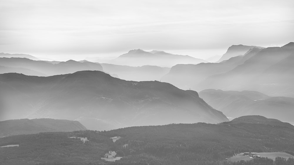 a black and white photo of a mountain range