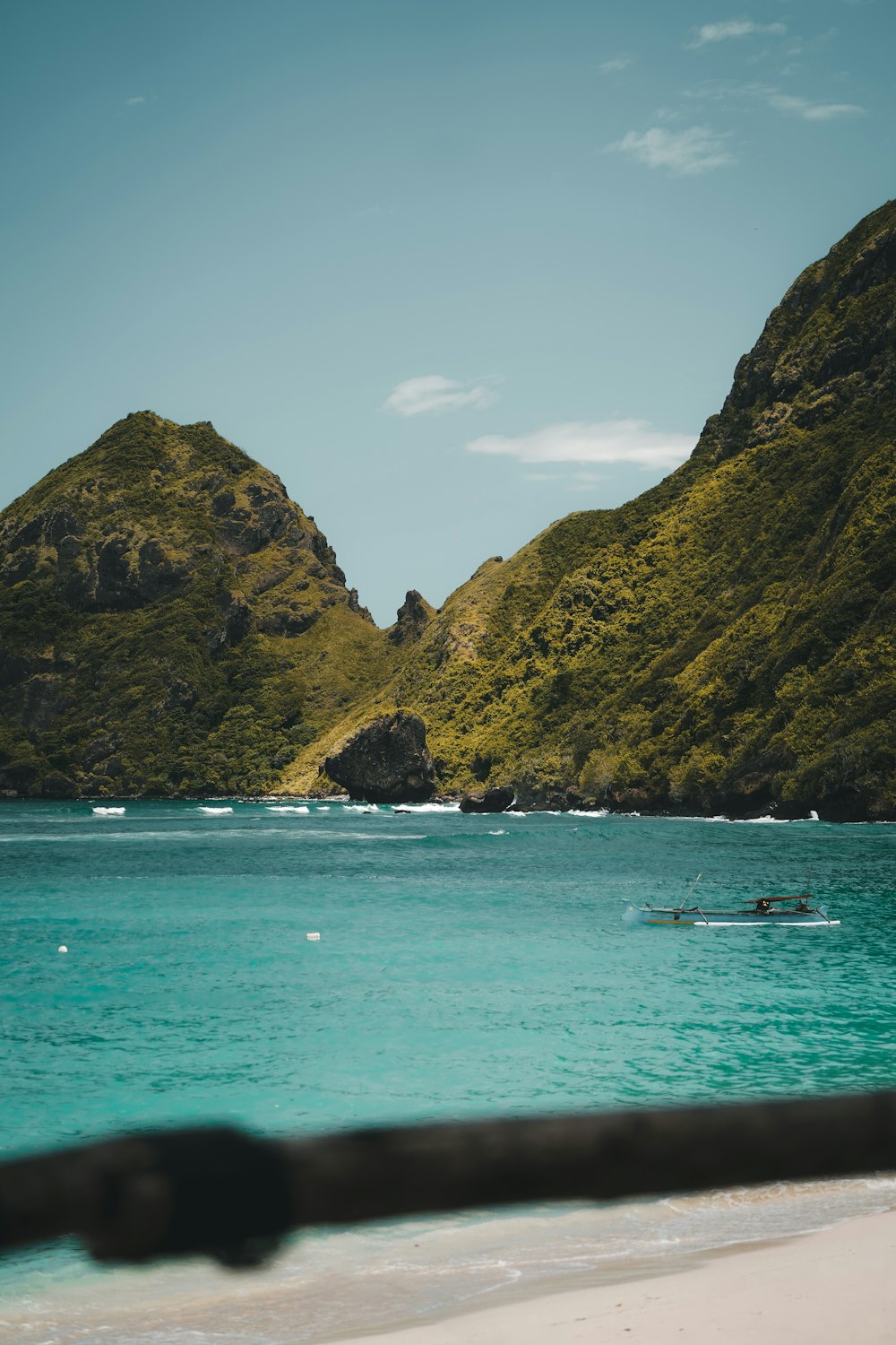 a body of water with mountains in the background