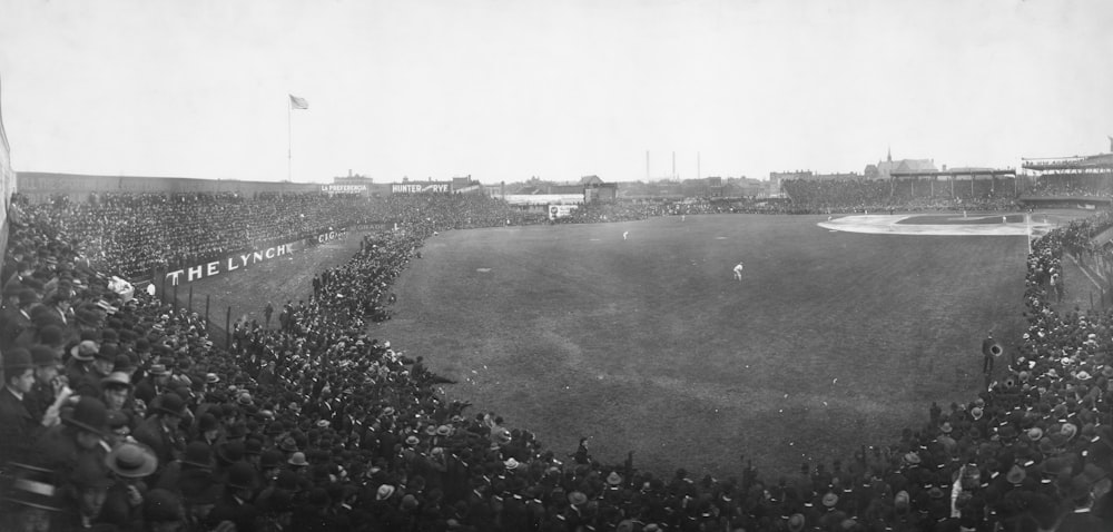 a crowd of people watching a baseball game