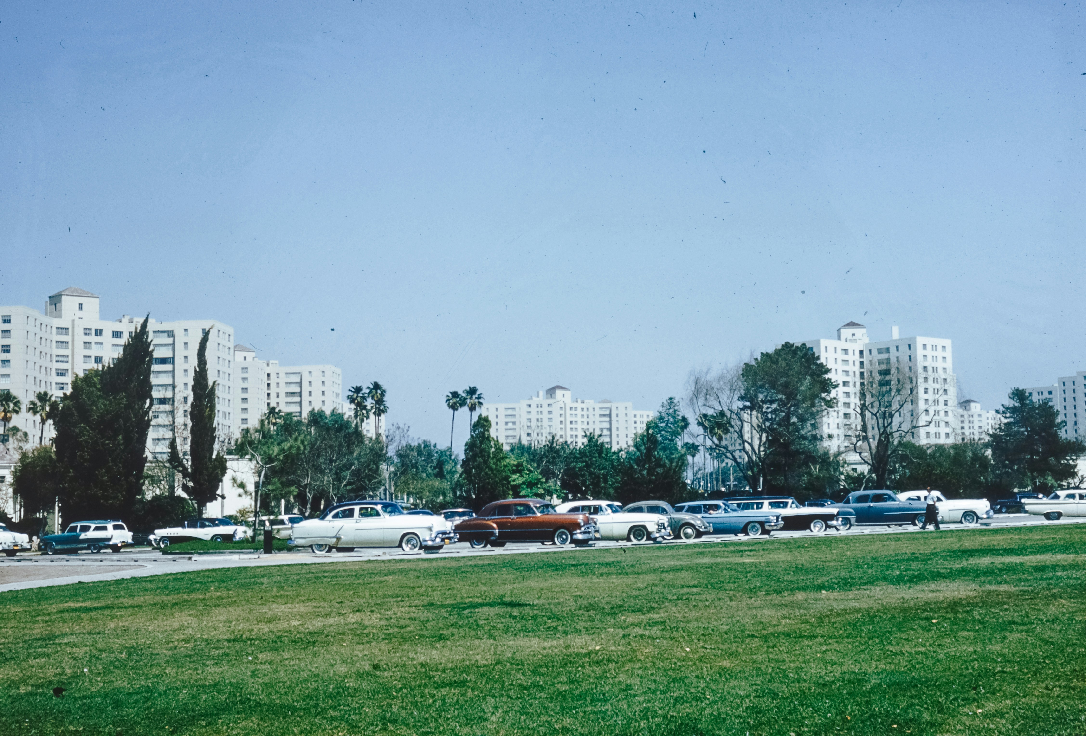 a bunch of cars parked in a parking lot