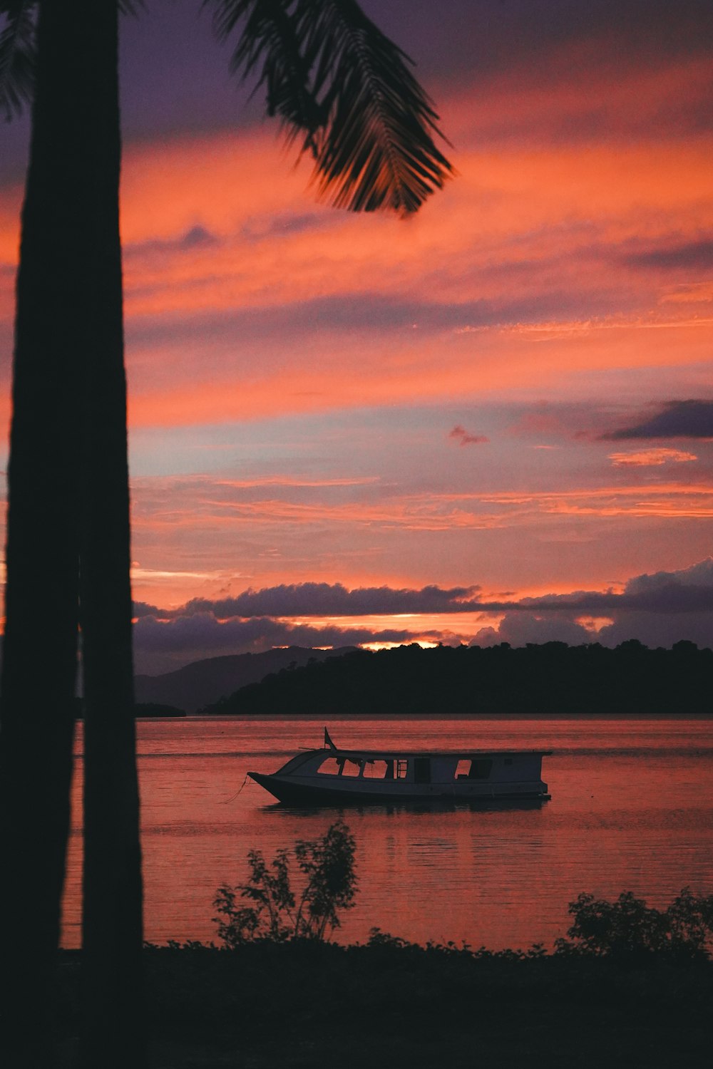 a boat floating on top of a body of water