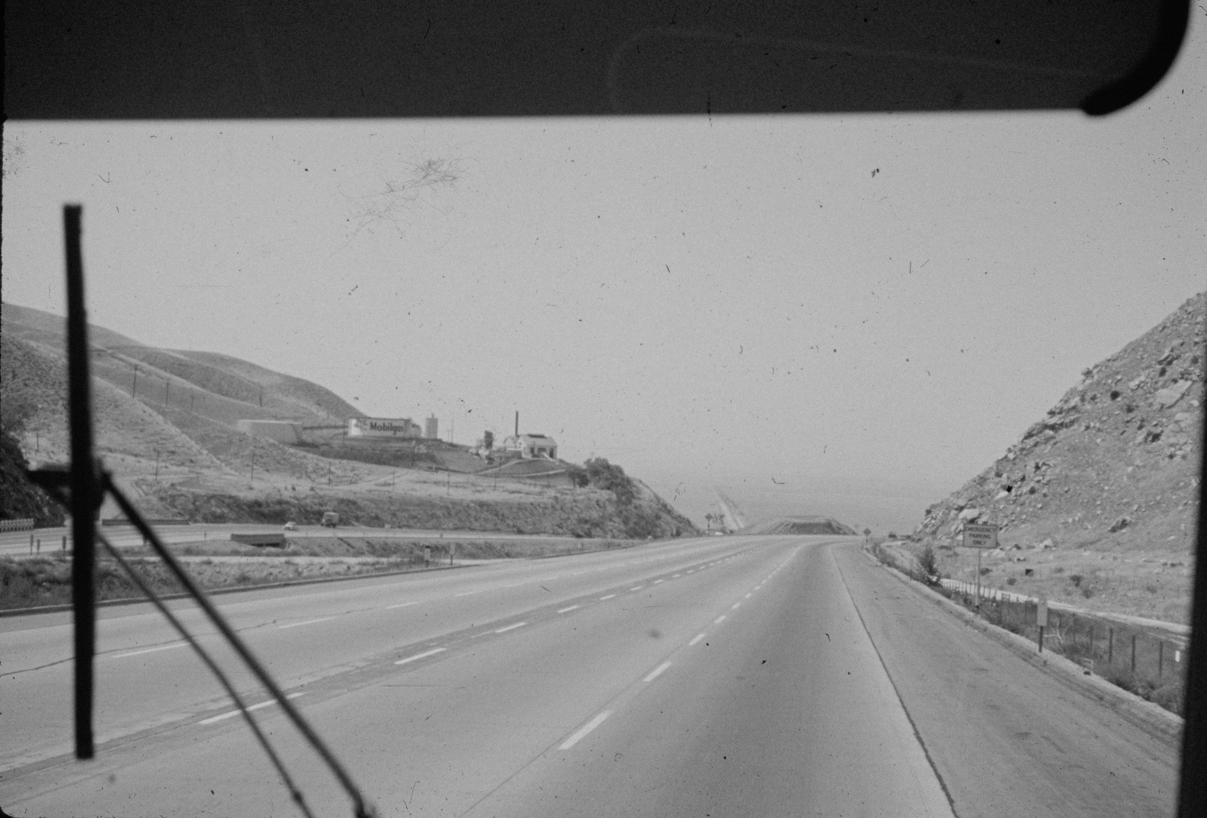 a black and white photo of a highway