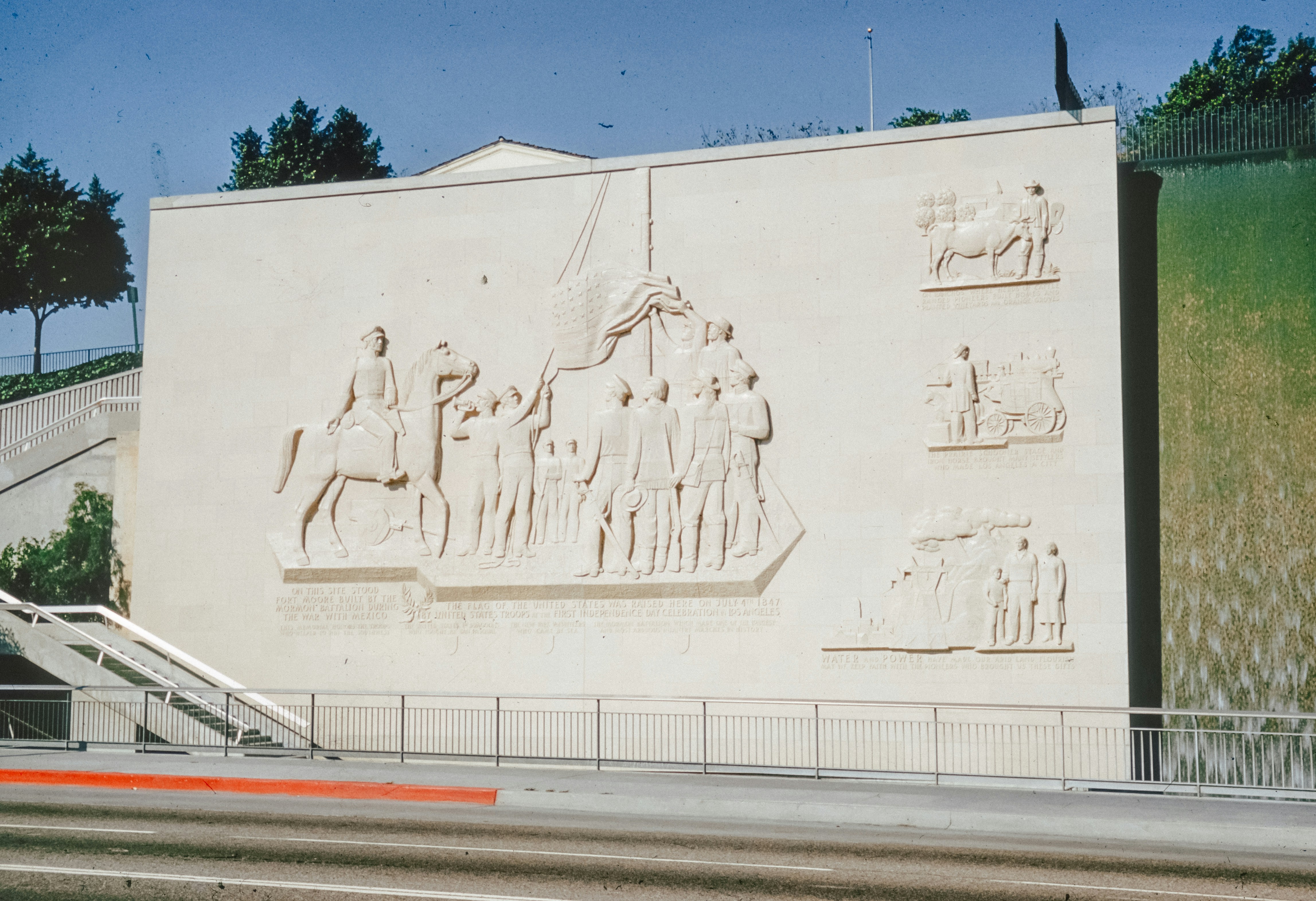 a large white building with statues on the side of it