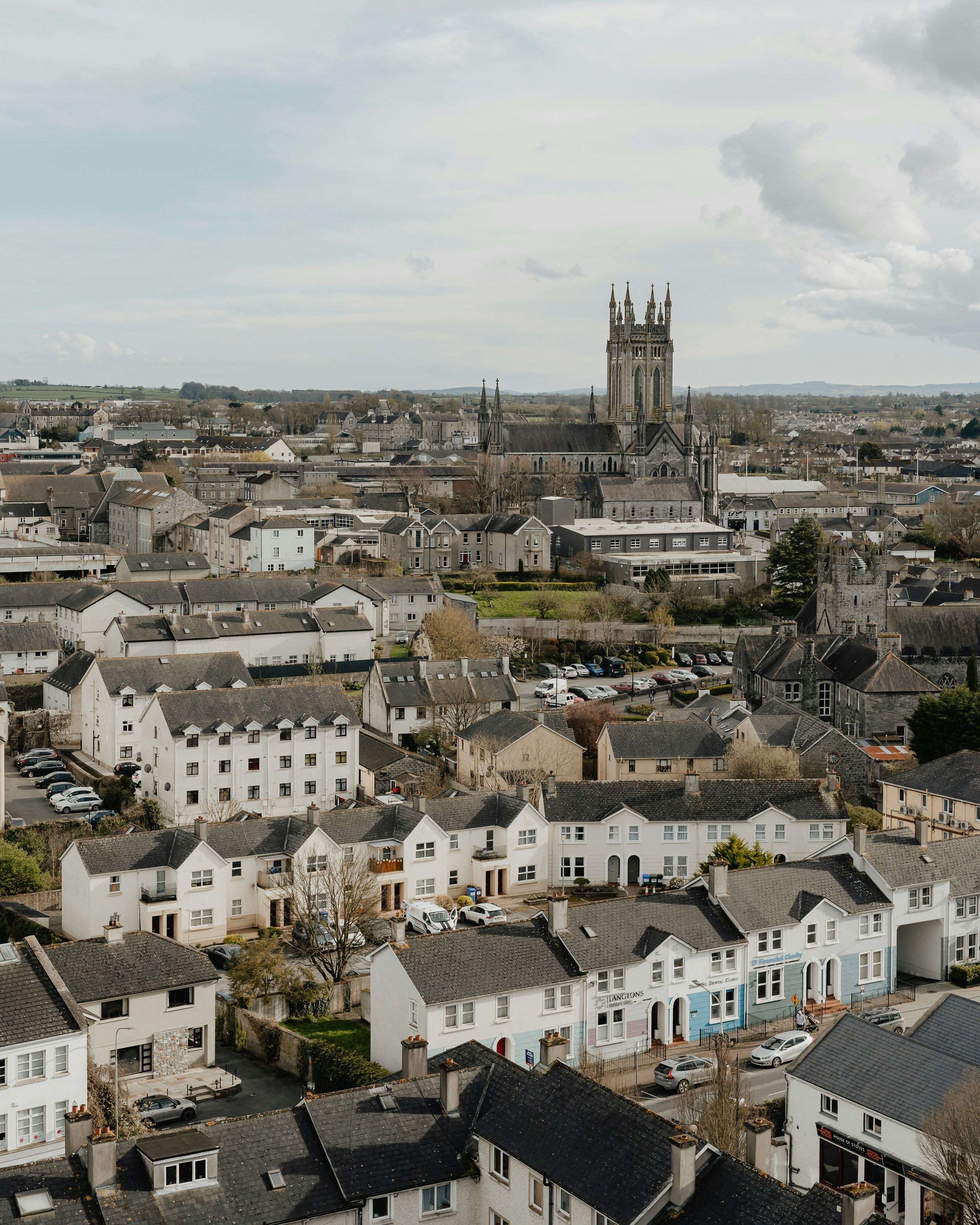 a view of a city with a cathedral in the background