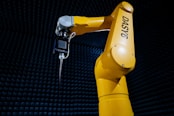 a yellow robot is holding a key in its hand