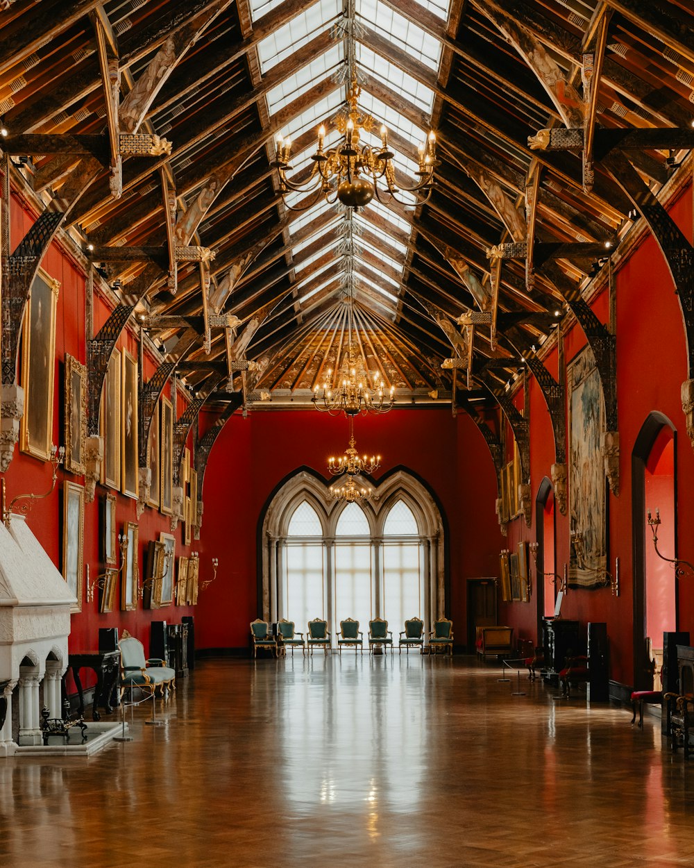 a large room with red walls and a wooden ceiling