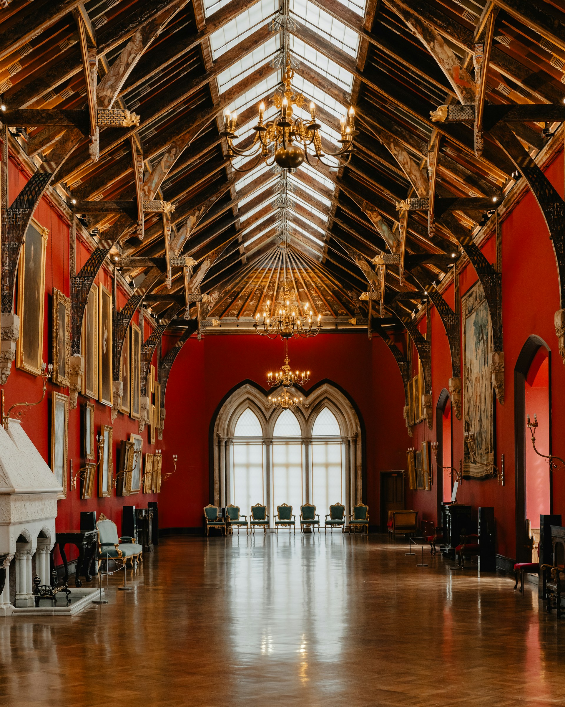 a large room with red walls and a wooden ceiling