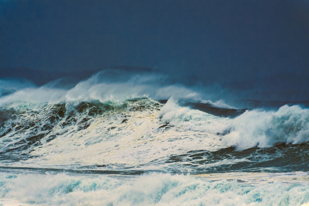 a painting of a large wave in the ocean