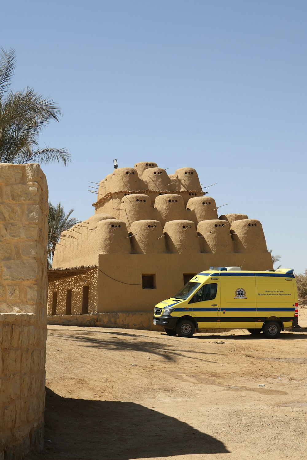 a yellow van parked in front of a building