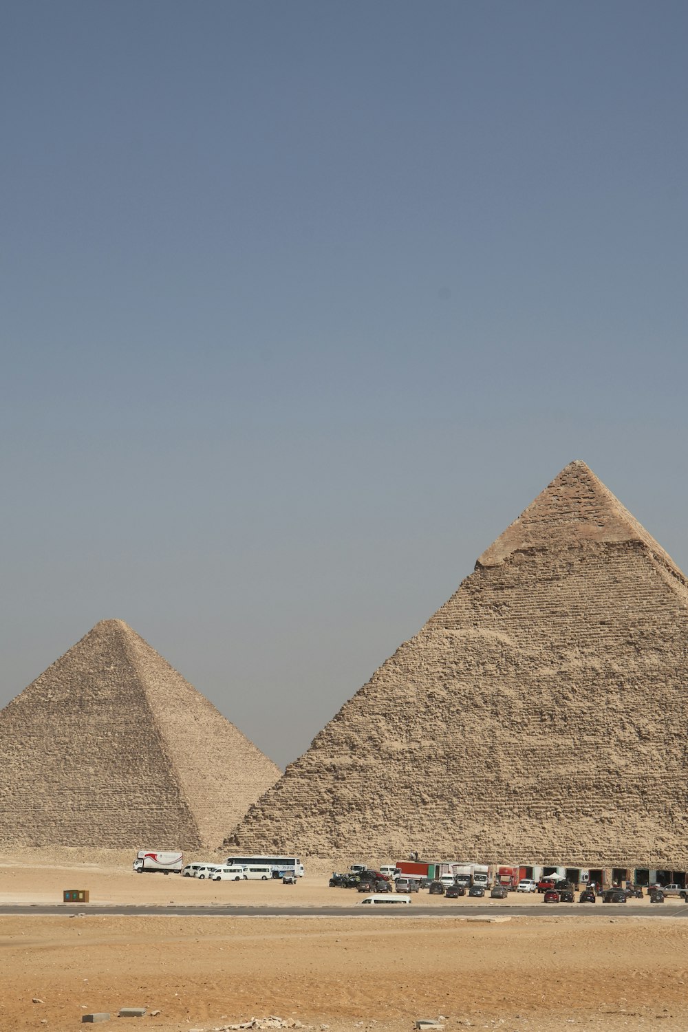 a bus driving past the pyramids of giza