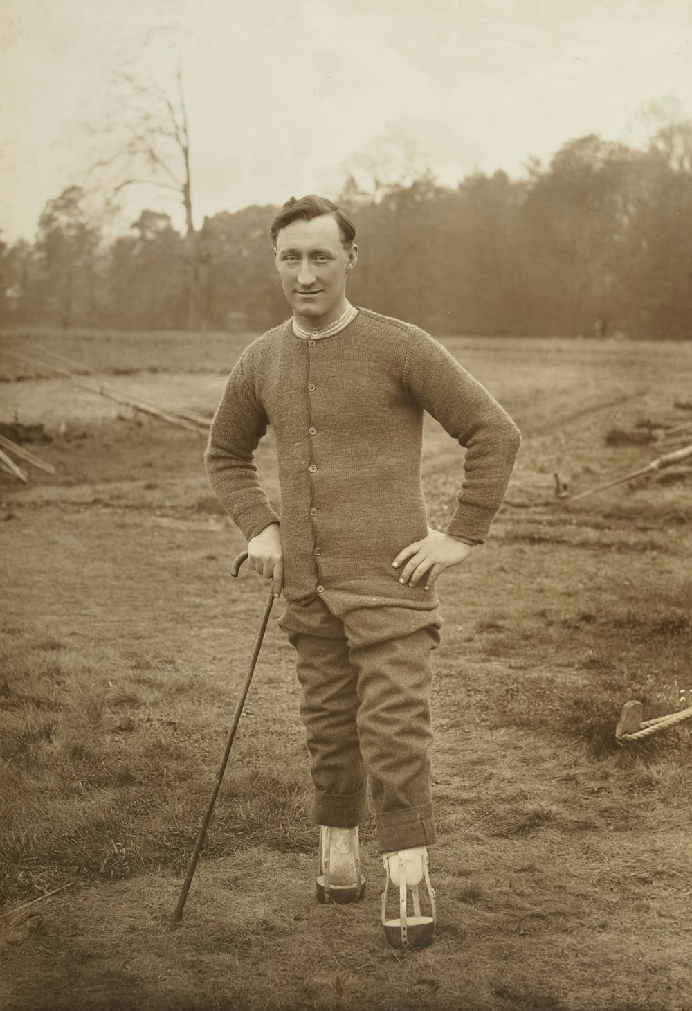 an old photo of a man with a cane