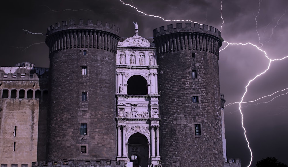 a castle with a lot of lightning in the sky