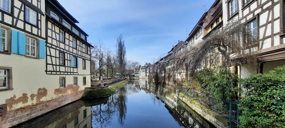 a river running through a city next to tall buildings