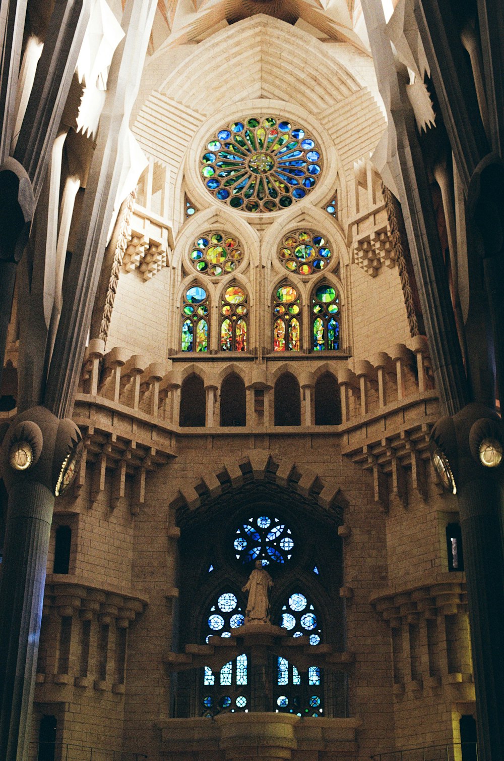the inside of a cathedral with stained glass windows