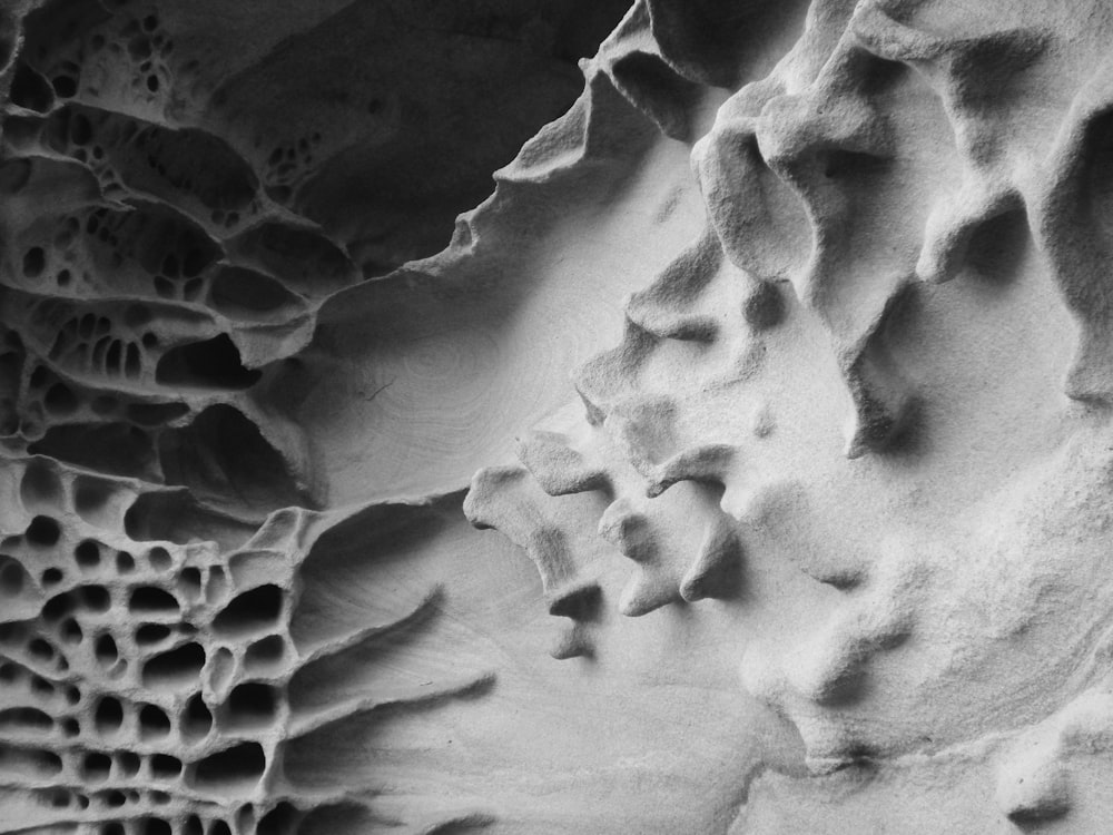 a black and white photo of a rock formation