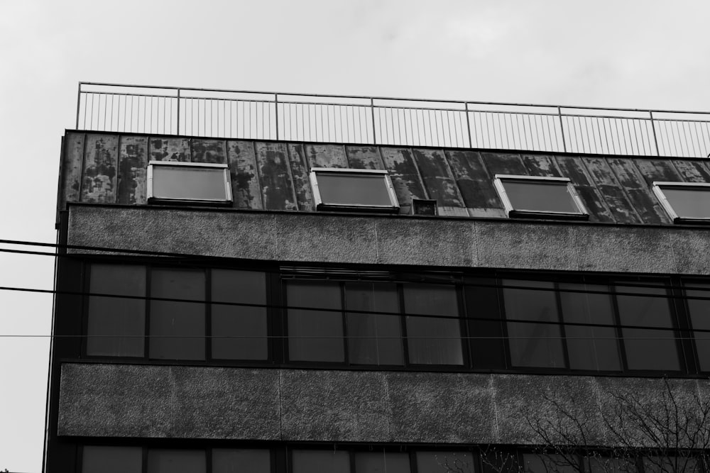 a black and white photo of a building with windows