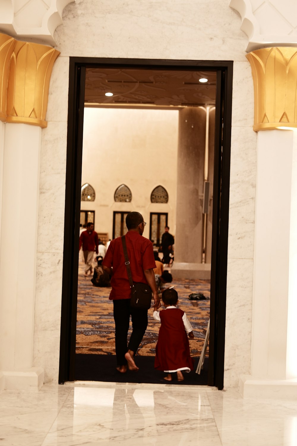 a man and a child are entering a building