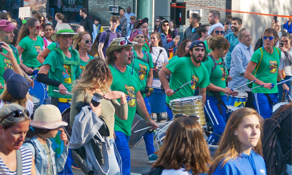 a large group of people walking down a street