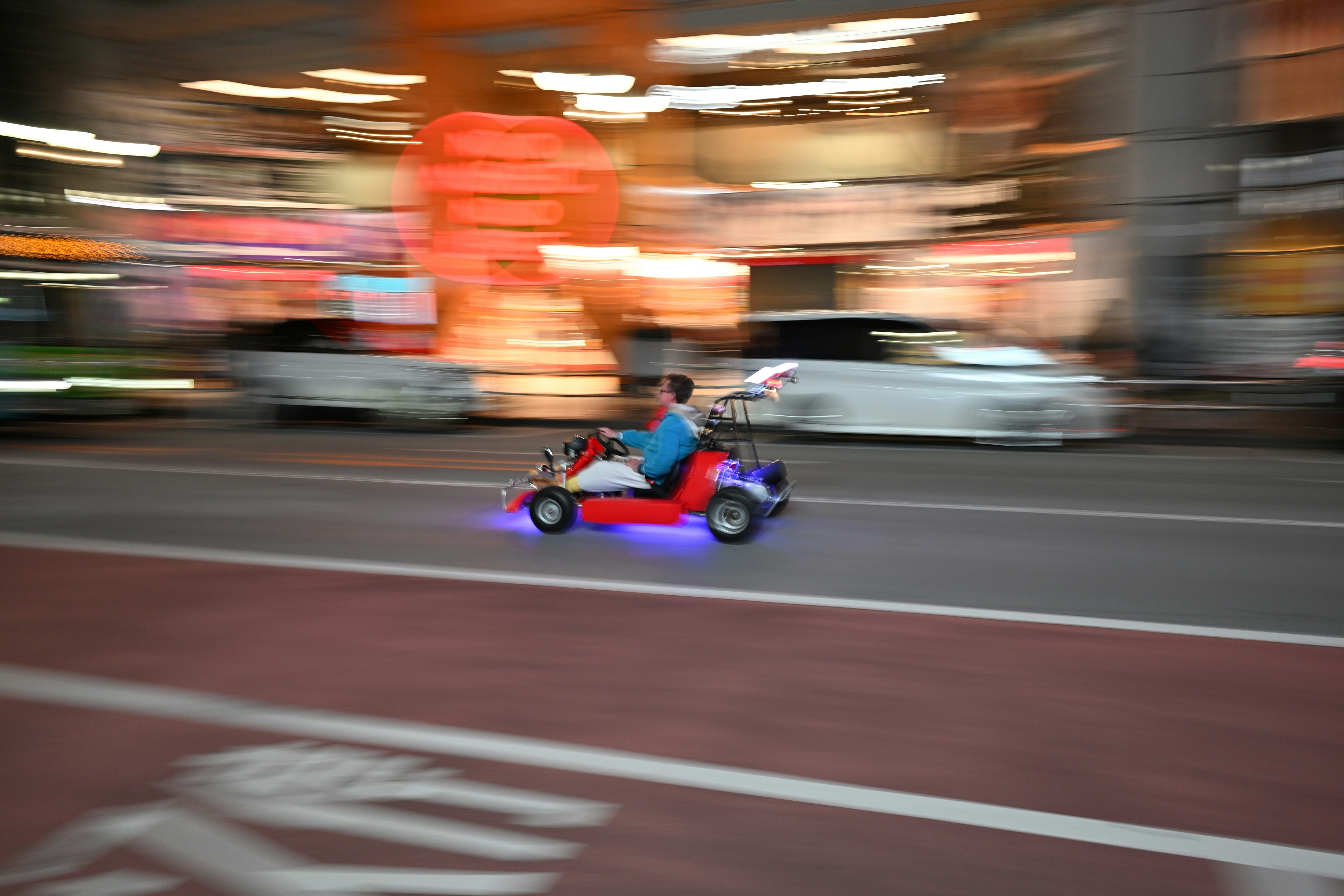 a person riding a motorized scooter on a city street