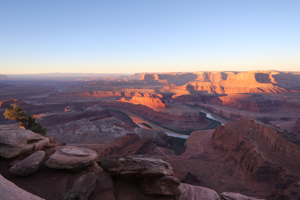 a view of a canyon with a river running through it