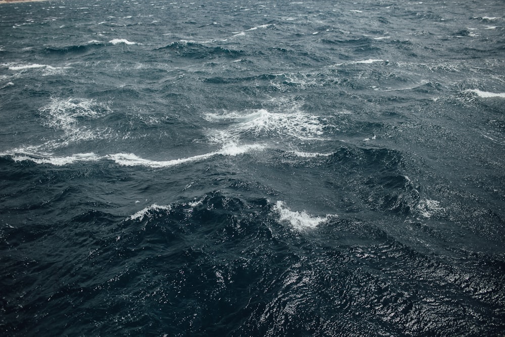 a large body of water with waves on it