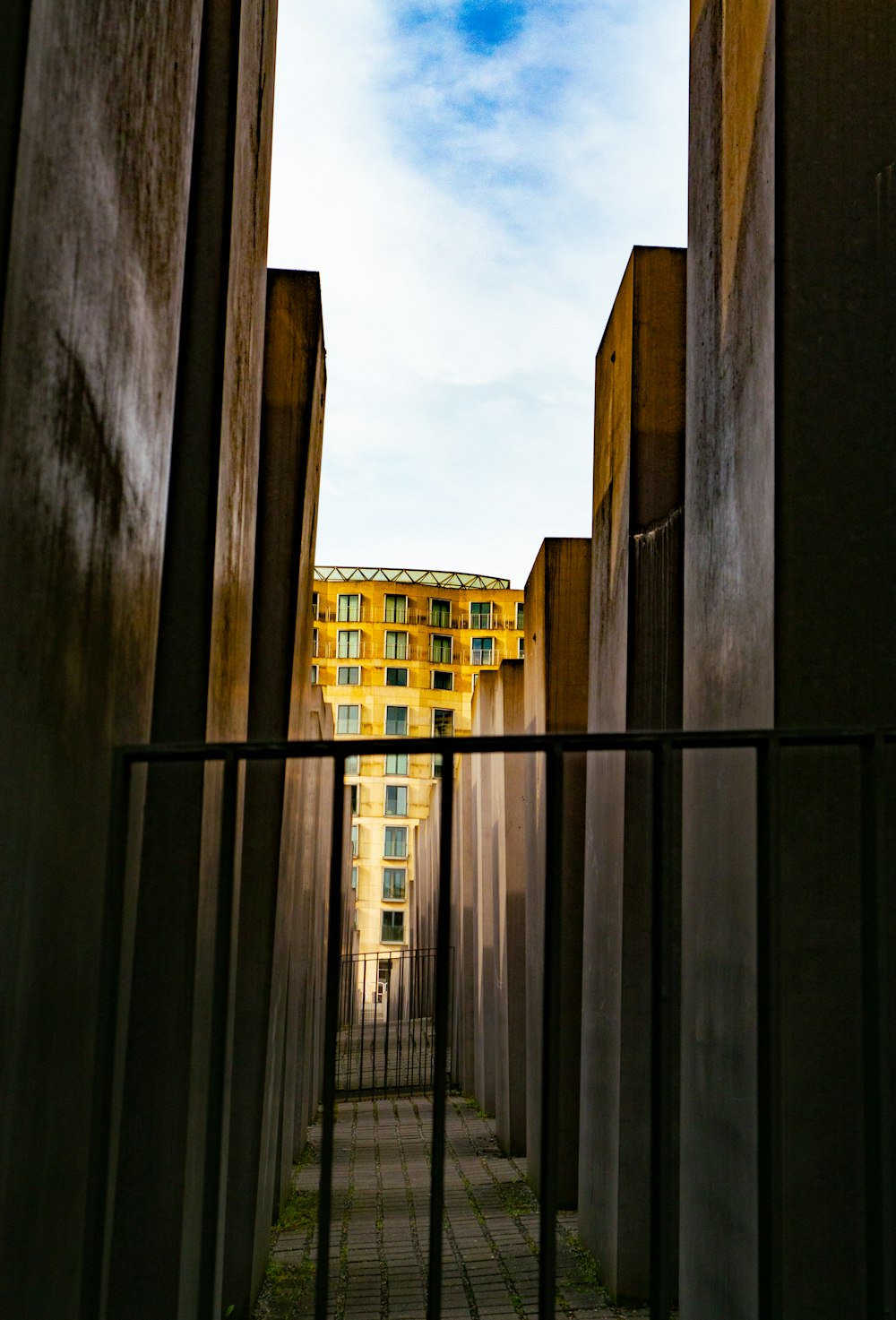 a view of a building through a gate
