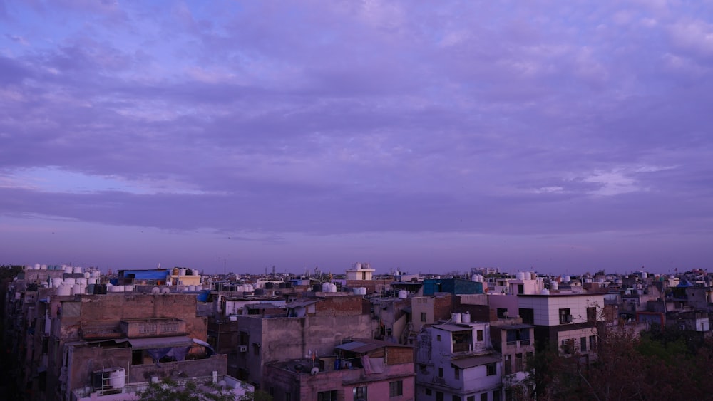a view of a city at dusk from a rooftop