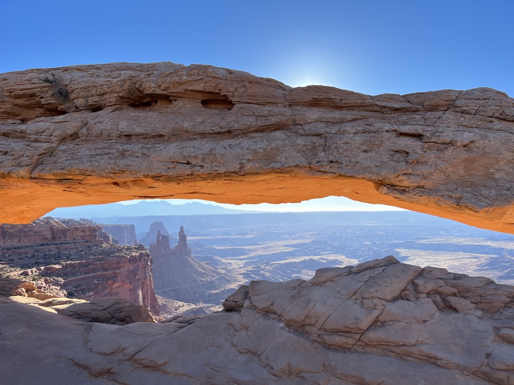 a view of the desert from a rock arch