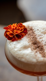 a drink with a flower on top of it