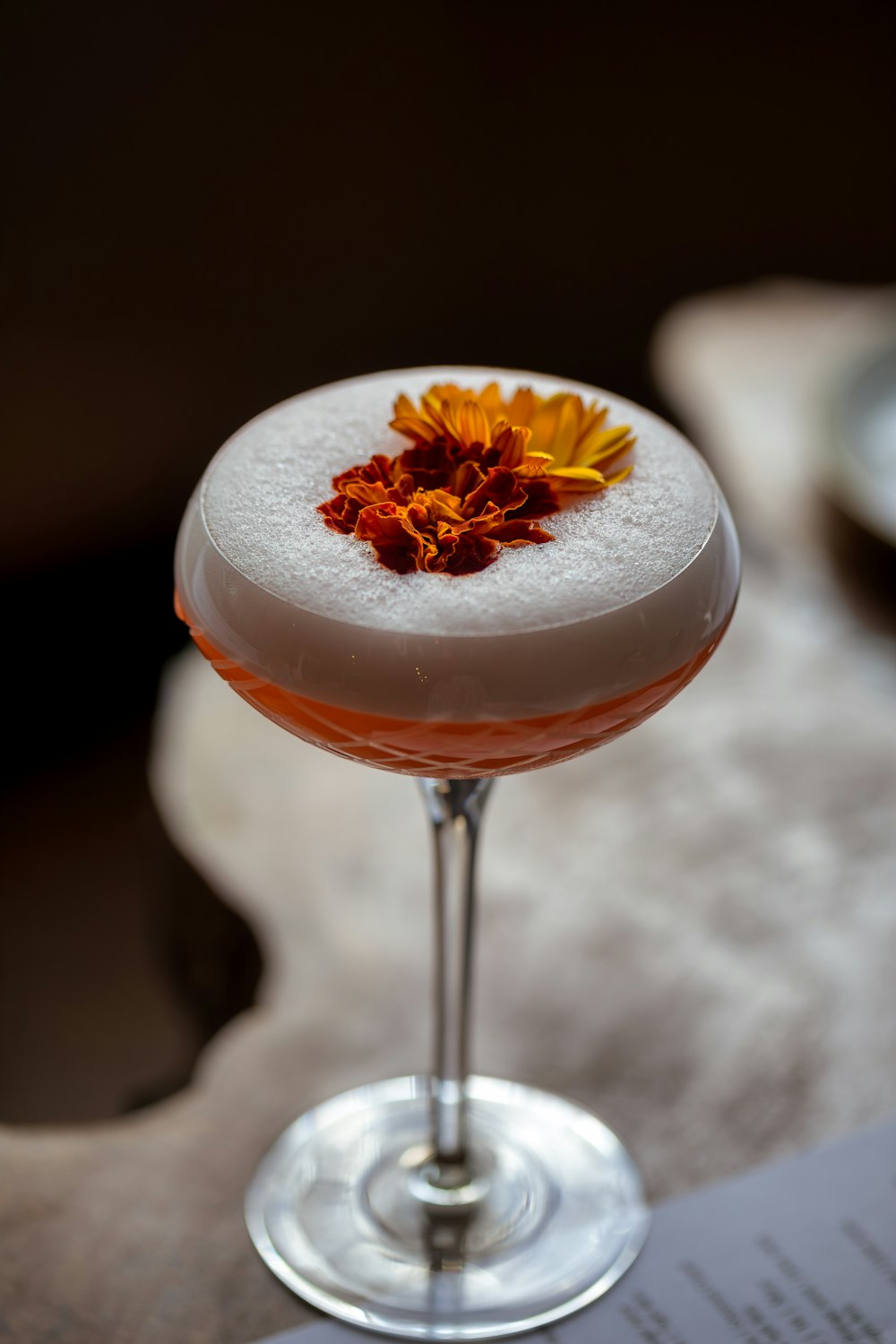 a drink with a flower on top of it