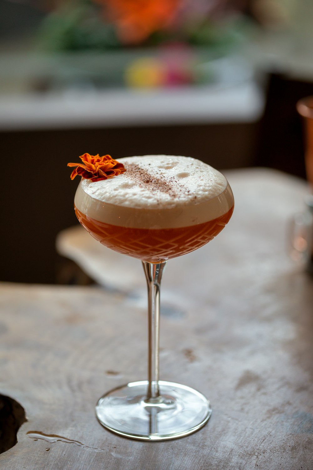 a drink sitting on top of a wooden table