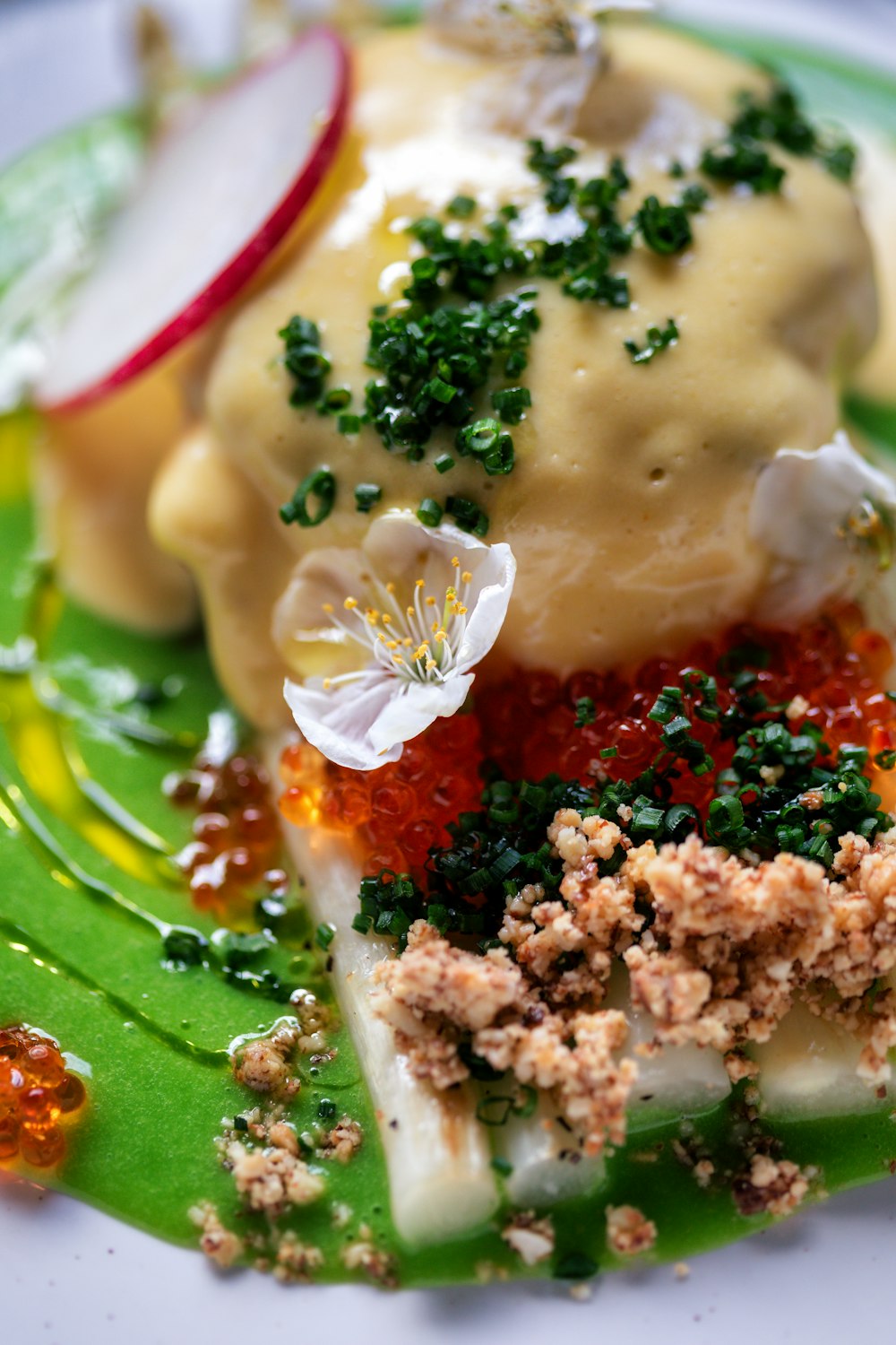 a green plate topped with a dessert covered in toppings