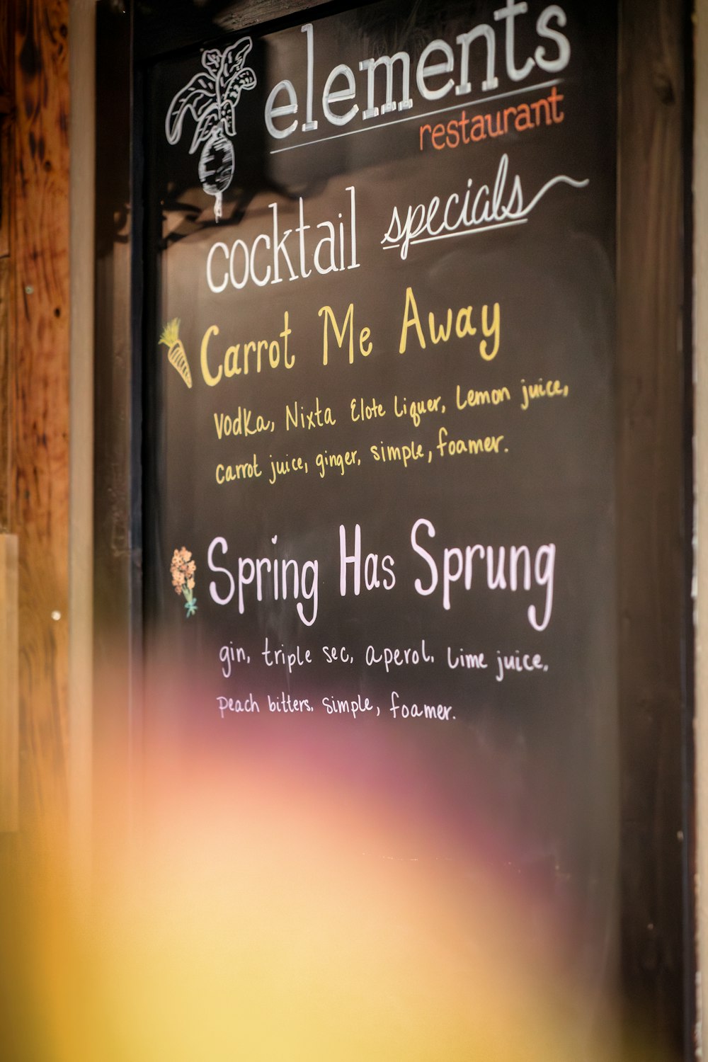 a menu for a restaurant on a blackboard