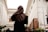 a woman in a burka walking down a street
