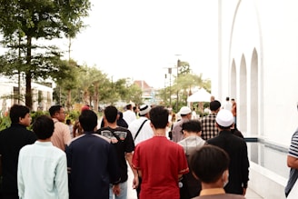 a group of people walking down a street
