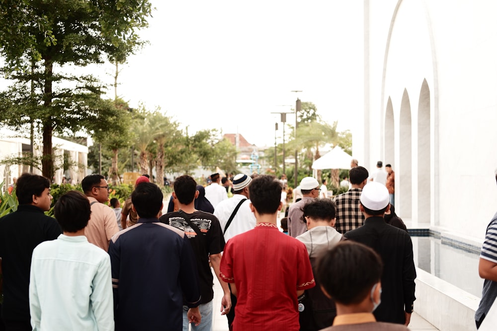 a group of people walking down a street