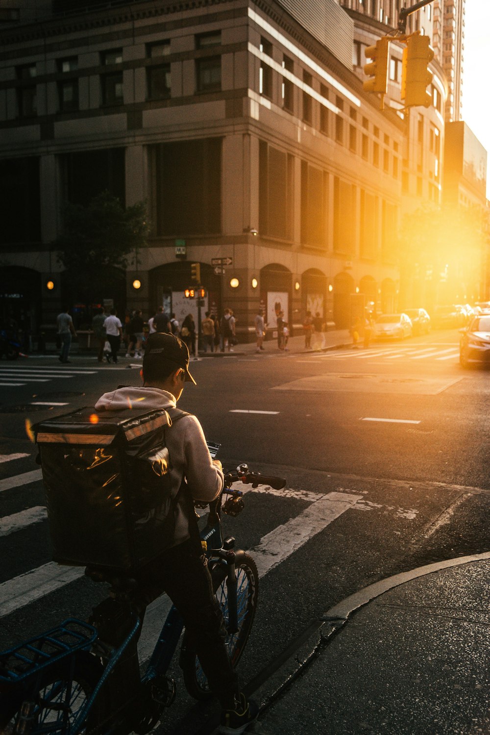 a person riding a bike on a city street