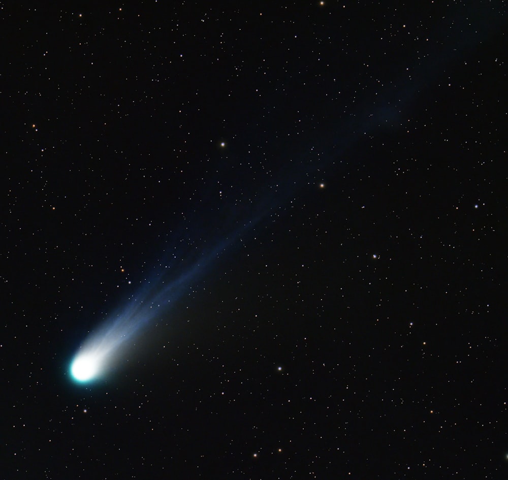 a bright blue object in the sky with stars