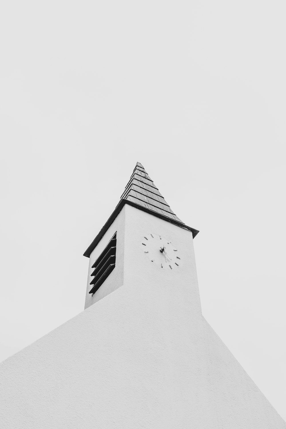 a black and white photo of a clock tower