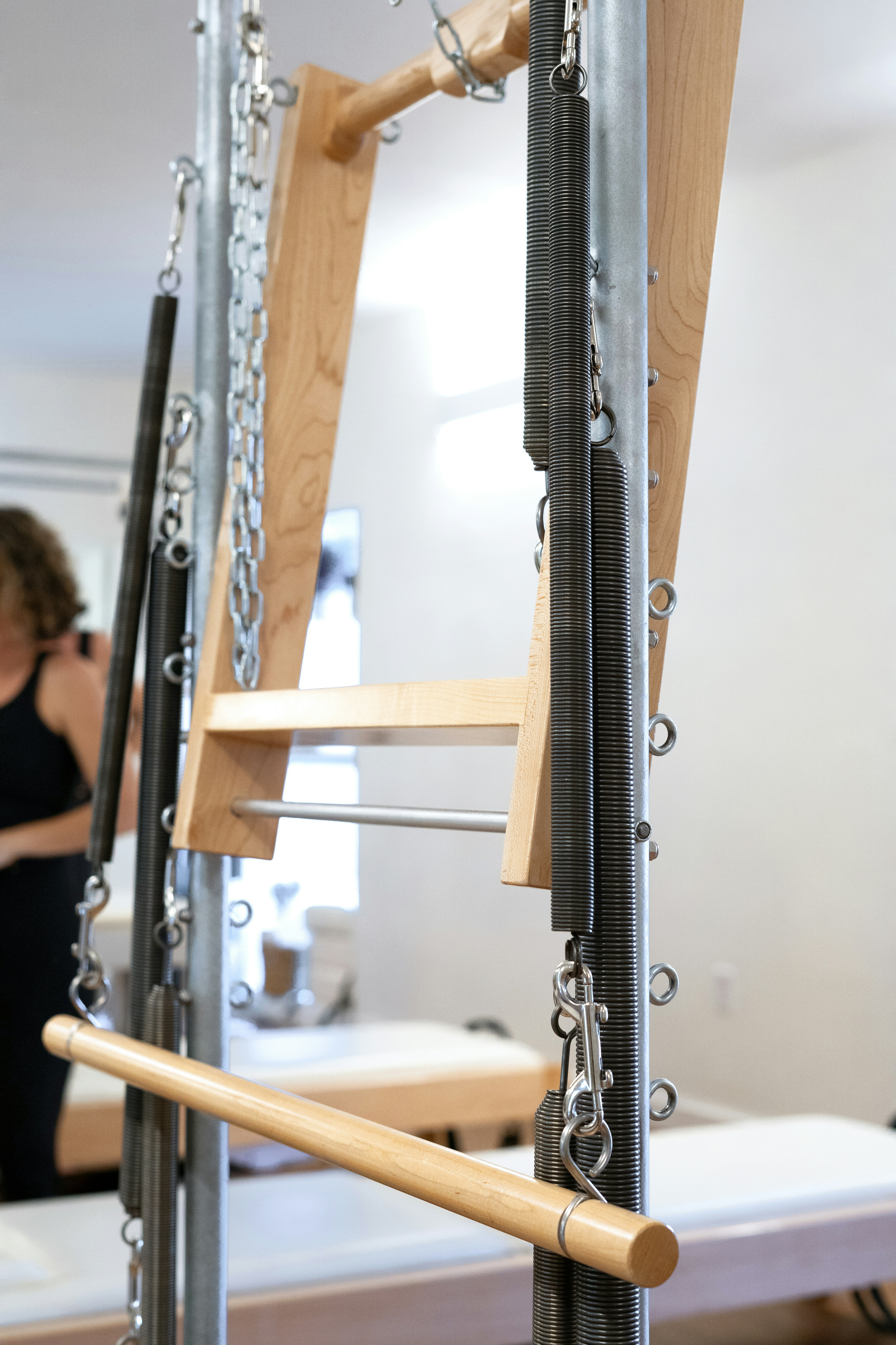 a woman taking a picture of a set of stairs