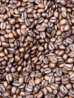 a pile of coffee beans is shown in this image
