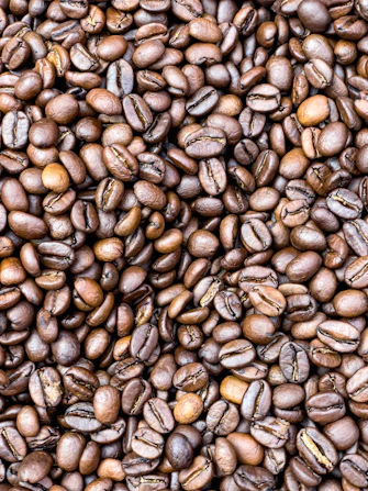 a pile of coffee beans is shown in this image