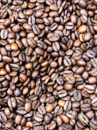 a pile of coffee beans is shown in this image