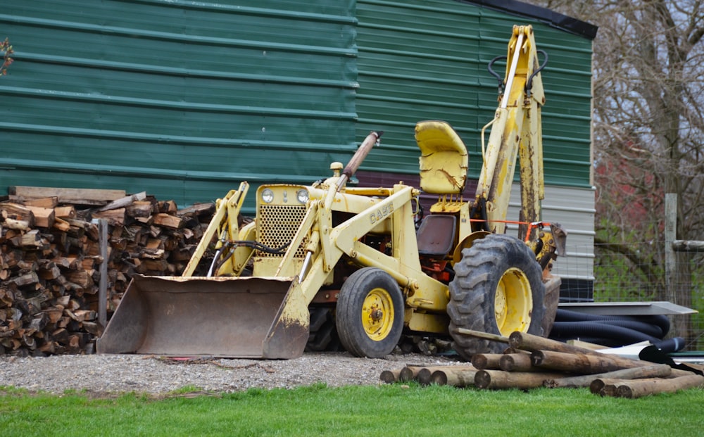 a tractor with a load of wood behind it