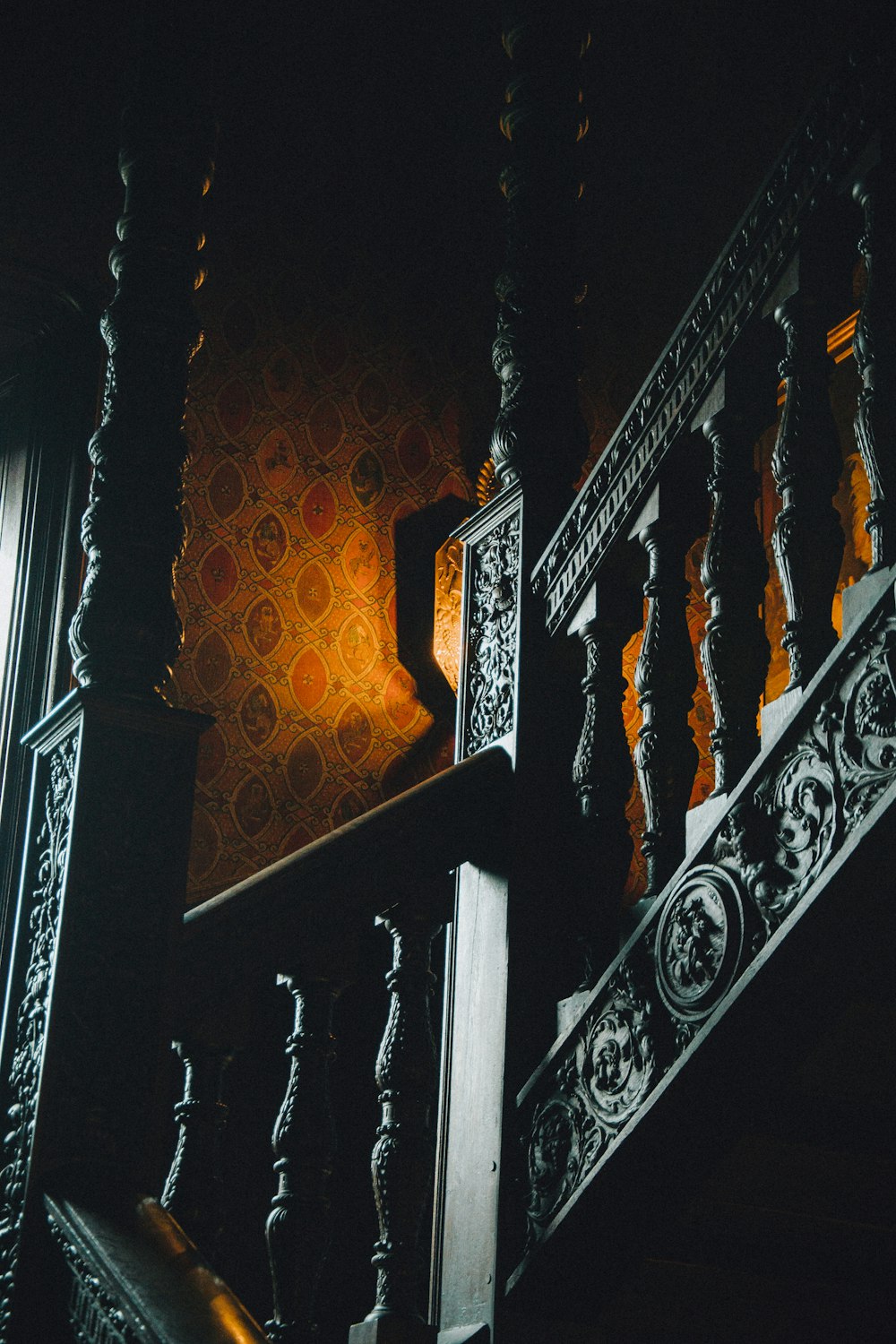 a stair case in a dark room with a light on
