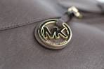 a close up of a michael kors bag