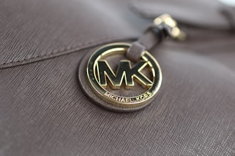 a close up of a michael kors bag