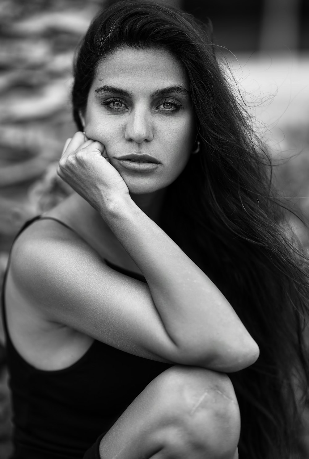 a black and white photo of a woman with long hair