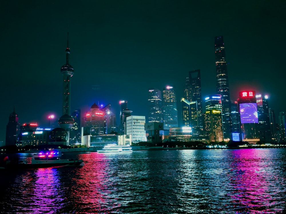 a large body of water with a city in the background